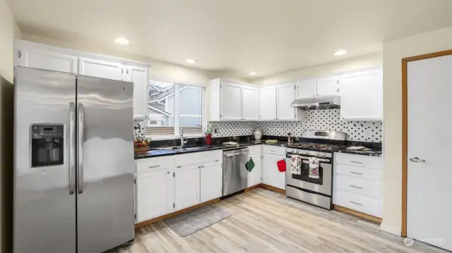 Very open kitchen layout.  Pantry door on the right.