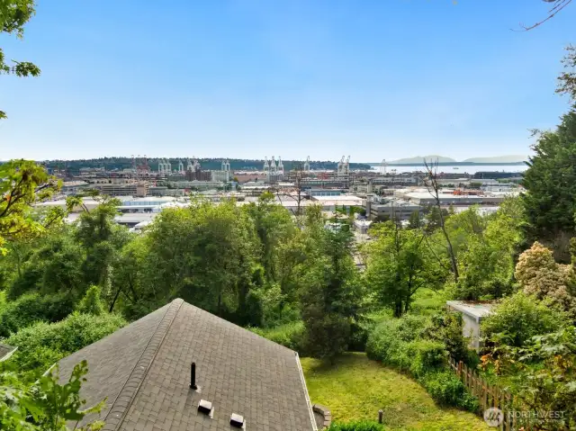 Take in sweeping views of the port, city, and mountains from your own backyard. This home offers a rare combination of privacy and perspective just minutes from the action.