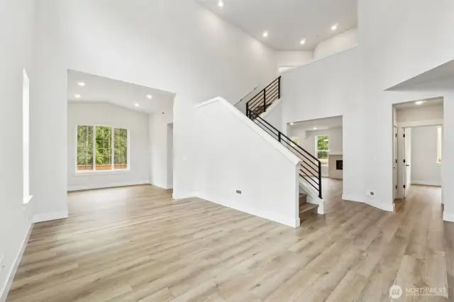 Look at all that light coming through all the windows.  LVP flooring throughout entire main floor, at stairs and upper hallways.