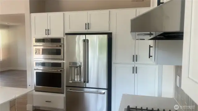 Wall oven microwave and oven.  Cafe style fridge w/bottom freezer.  Large pantry.