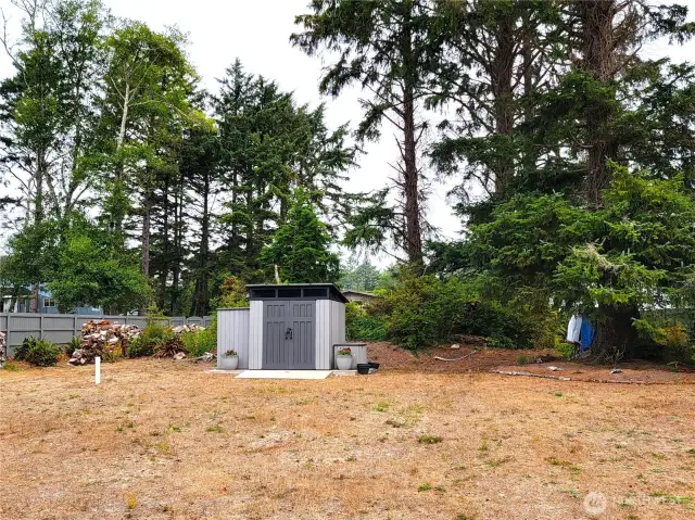 Flat lot, cleared for homesite with mature trees & natural-scape on north end of lot...
