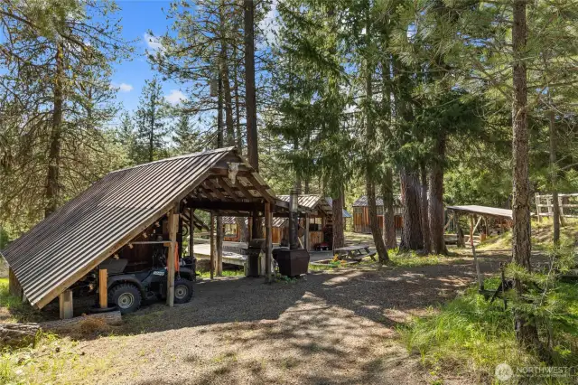 The Cook Shack has extra covered parking for your 4wheeler, BBQ & woodstove!
