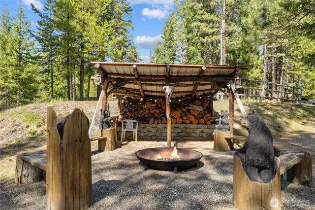 Awesome firepit with covered wood storage