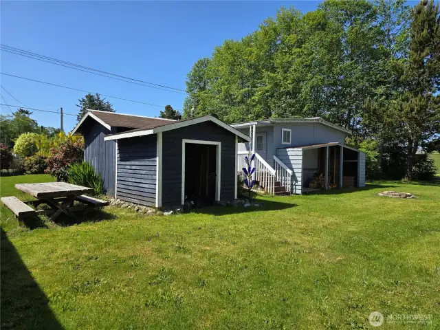 Garden shed and wood storage.