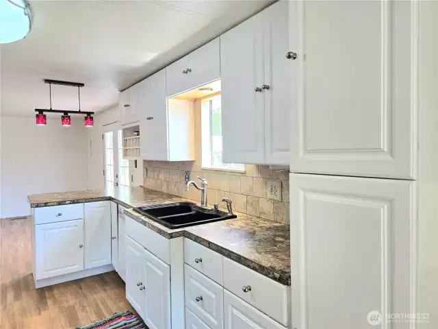 Cabinets with pantry space.