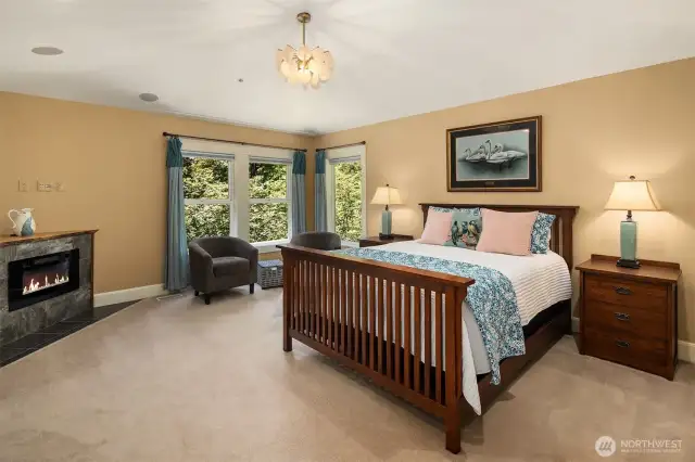 Primary suite with gas fireplace and sitting area.