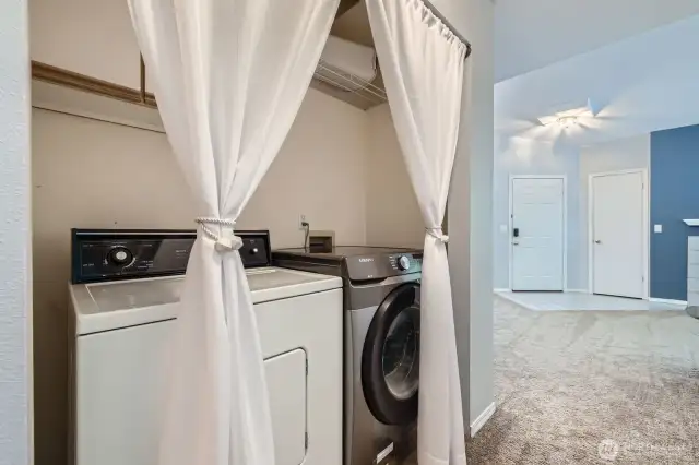 Great Laundry Space with overhead shelves