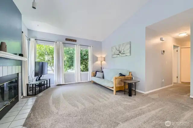 Living Room with Wall of Windows & Vaulted Ceilings