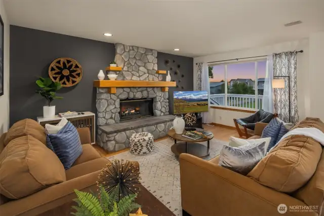 Living room with stone fireplace.