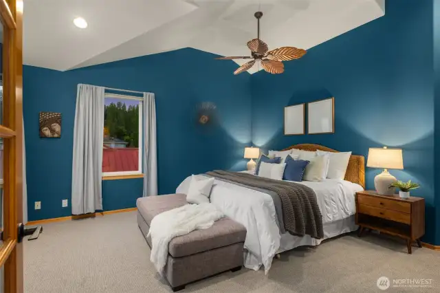 Luxury primary suite with private sound-view deck and cozy fireplace