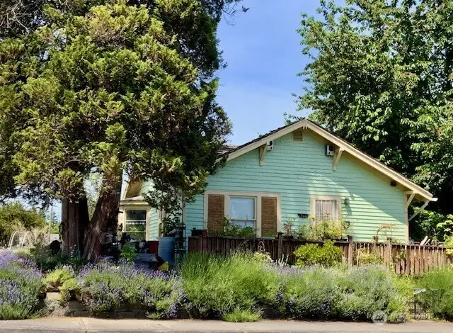 Charming single story craftsman on prime corner lot.