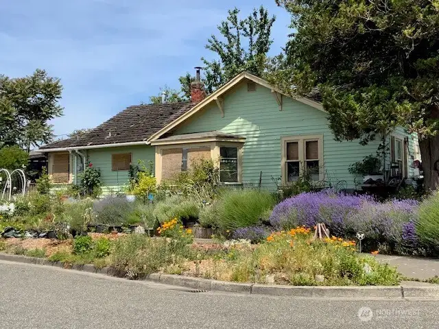 Charming Corner Craftsman awaits to welcome you home!