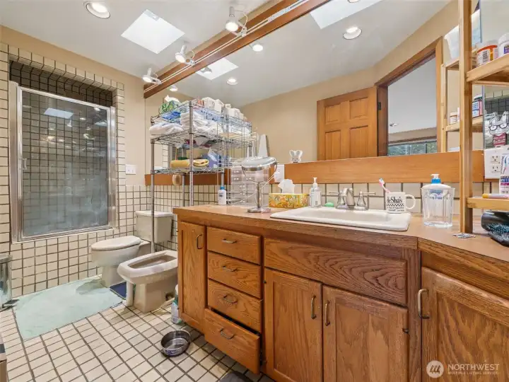 The primary bathroom is in original form yet ready for your vision