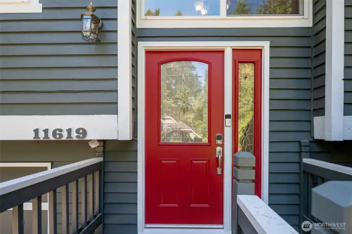 Warm and welcoming front door lets in lots of light