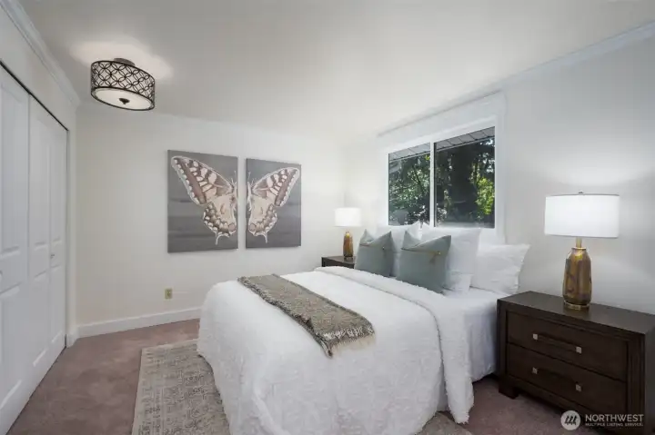 Large primary bedroom includes new carpet, fresh paint and updated en suite