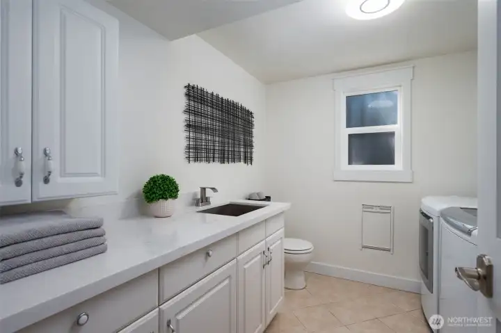 Laundry and half bath, this space is already plumbed for a shower.