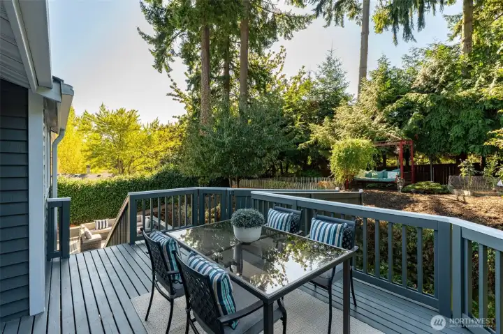 Multiple decks for entertaining outdoors, this backyard is truly an oasis.