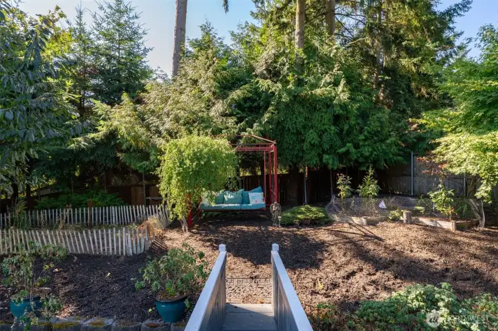There are several raised beds making this backyard a gardeners delight.