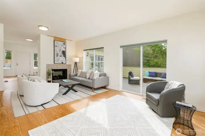 Spacious living room adjoins large deck.
