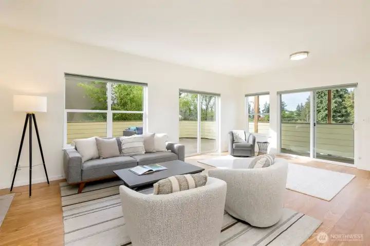 Spacious living room adjoins large deck.