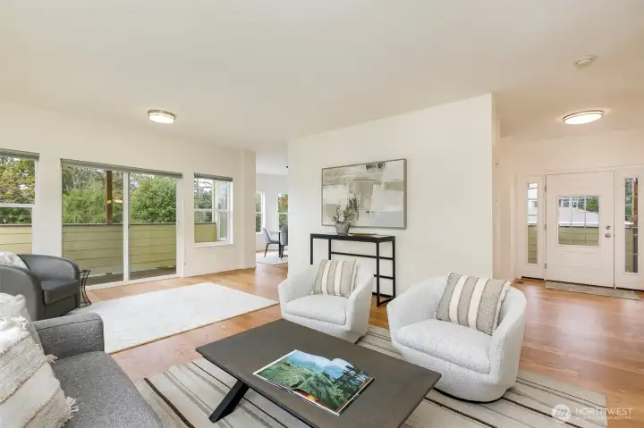 Spacious living room adjoins large deck.