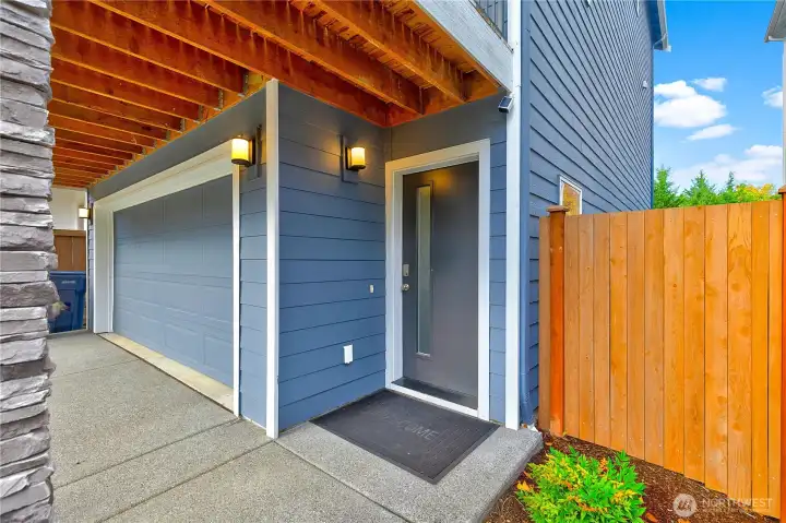 Spacious garage and grand front entrance.