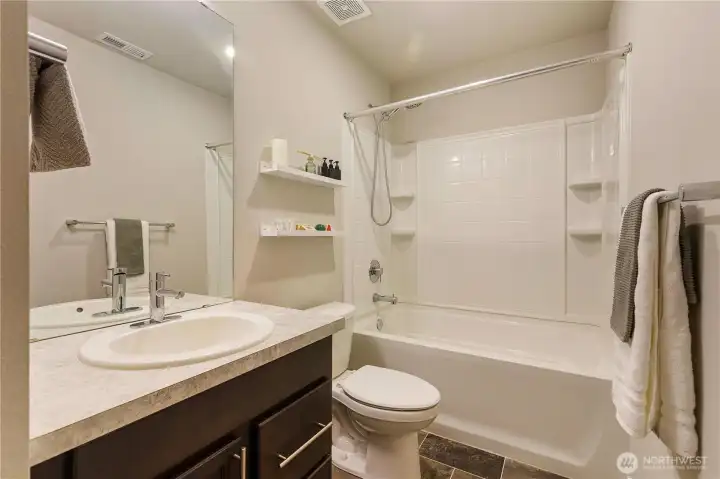 Spacious full bathroom on the third floor.