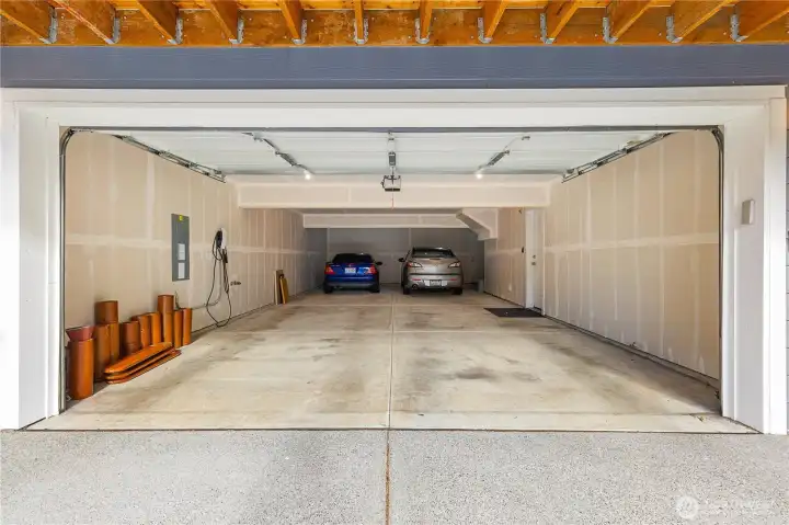 Even with two cars parked, the spacious garage can still accommodate up to four large vehicles.