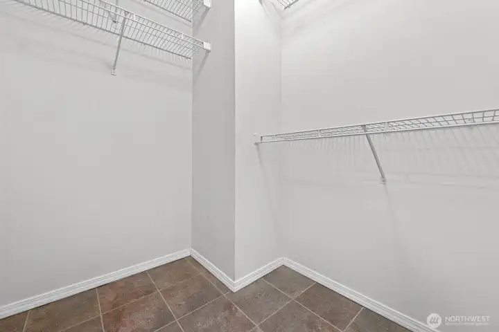 Primary bedroom walk-in closet.