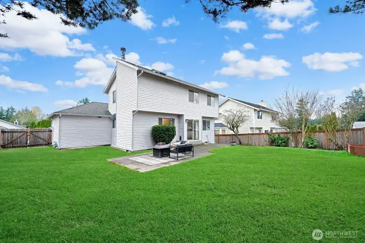 Gate opens for vehicle access to the rear yard.