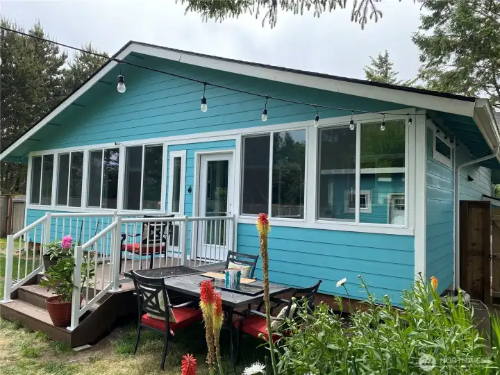 Rear view of the home with an Enclosed Rear Deck.