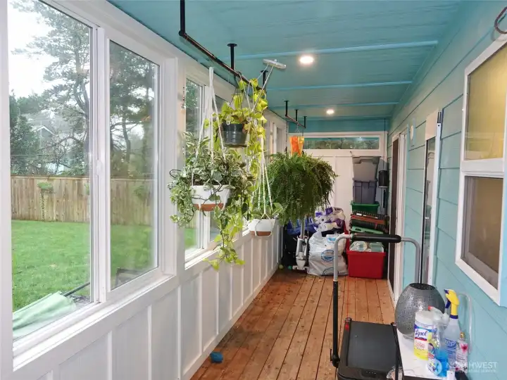 Enclosed Rear Deck with lots of natural light.