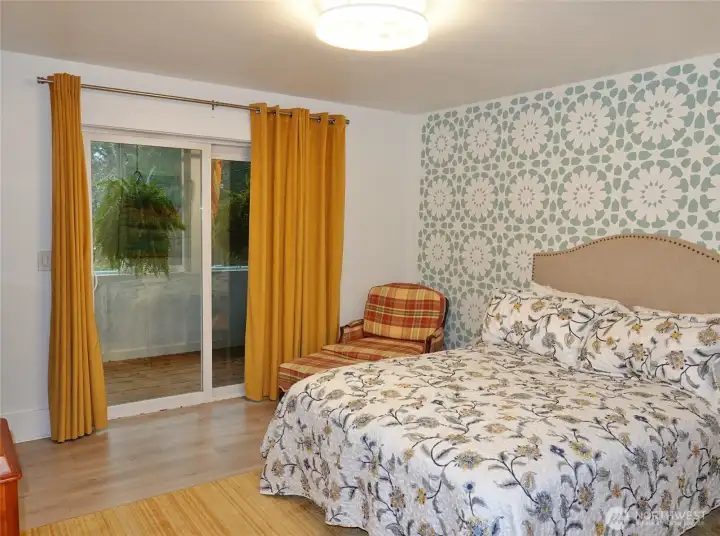 Master Bedroom w/ a slider to the enclosed rear deck.