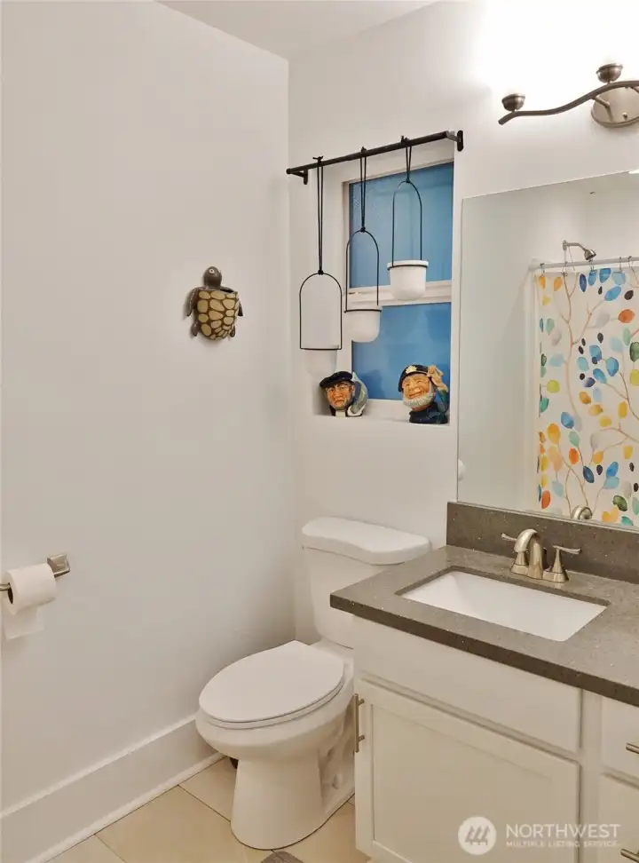 Master Bathroom w/ tile floors and shower.