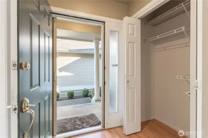 Front door with large coat closet.