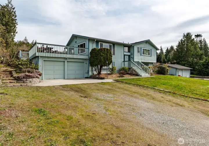 2 car garage in main dwelling and detached 3 car garage.