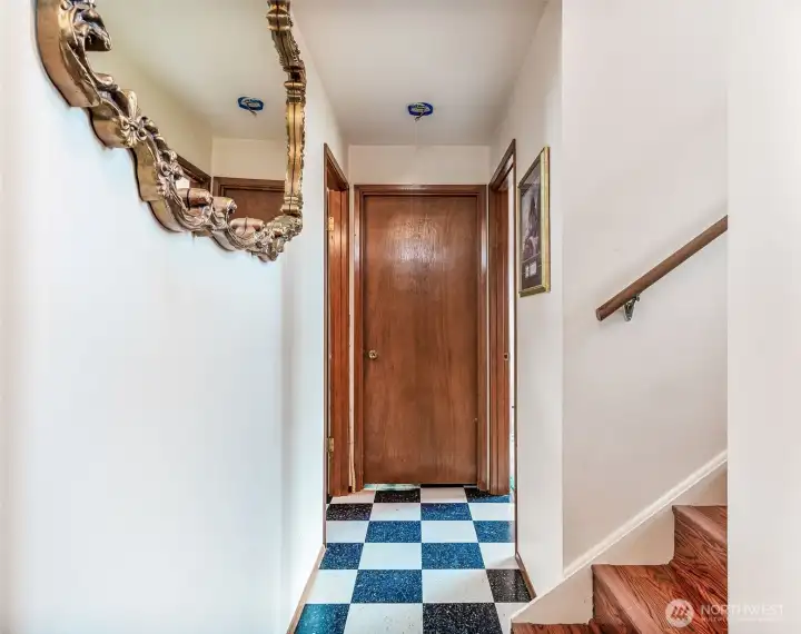 Lower level hallway, 3/4 bathroom on left, 3rd bedroom and library/office