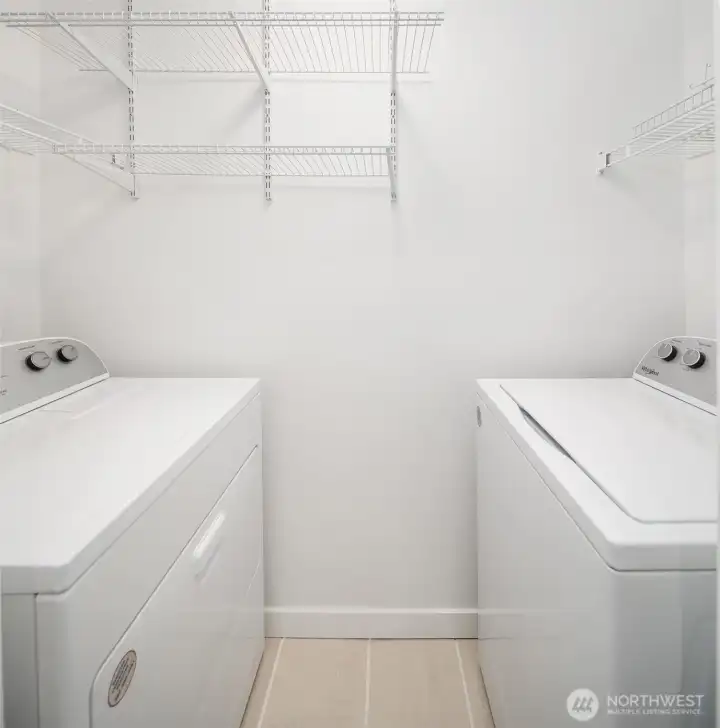 Just off the bathroom is a separate space for new washer and dryer plus storage.  All new appliances.