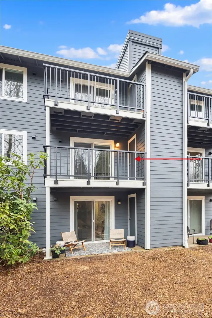 The second level terrace just off the living room overlooks a private preserved green belt.