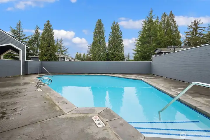 The outdoor pool is steps away adjacent to the community clubhouse.