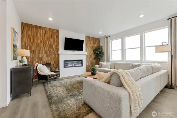 Spacious great room with large windows and electric fireplace. Pictures are for representational purposes only, colors and features may vary. Spacious great room with large windows and electric fireplace. Pictures are for representational purposes only, colors and features may vary.
