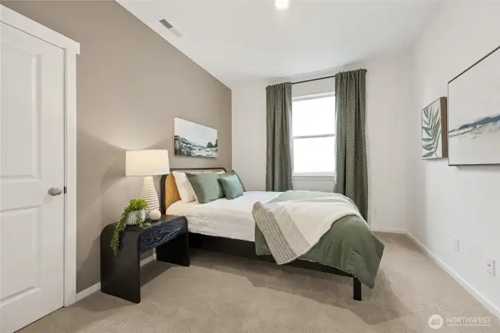 Downstairs bedroom/office shown with a full sized bed and large walk in closet. Pictures are for representational purposes only, colors and features may vary. Downstairs bedroom/office shown with a full sized bed and large walk in closet. Pictures are for representational purposes only, colors and features may vary.