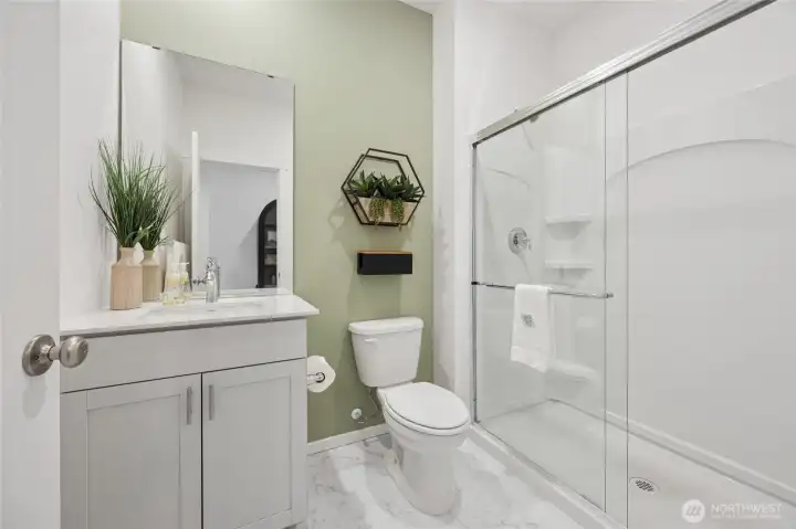 Downstairs 3/4 bathroom features a walk-in shower. Pictures are for representational purposes only, colors and features may vary. Downstairs 3/4 bathroom features a walk-in shower. Pictures are for representational purposes only, colors and features may vary.