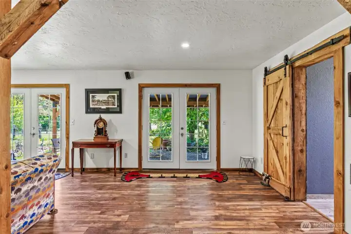 Two sets of french doors allow copious natural light.