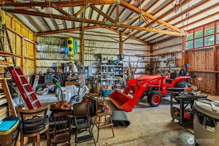 Giant shop area with sliding doors plus man doors, concrete floors, good lighting.