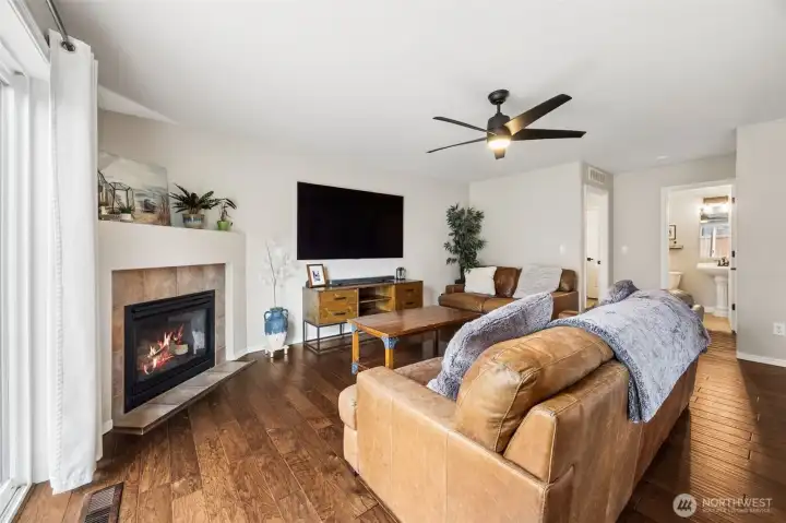 Family room off kitchen with cozy gas fireplace.