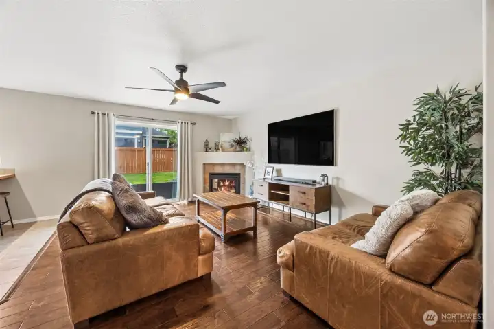 Slider leads to fully fenced back yard.