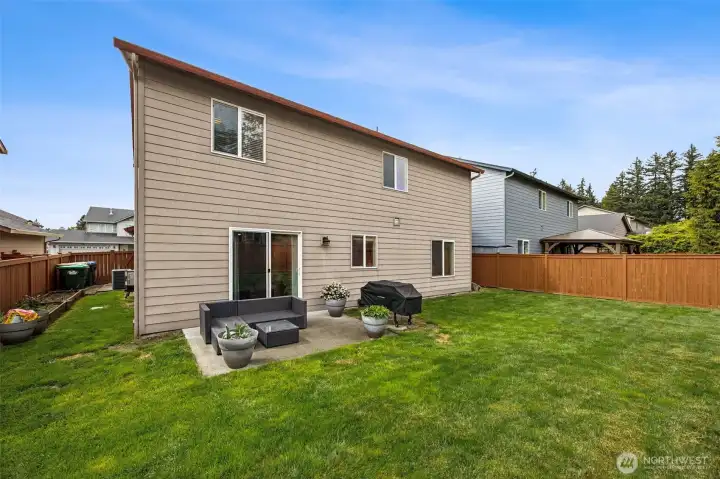 Fully fenced lot with patio, garden beds and AC and Irrigation system, front and back.