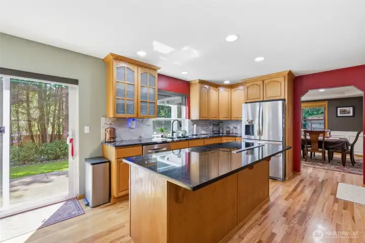 Chefs' kitchen, granite countertops, stainless upgraded appliances, and room to move preparing and entertaining.