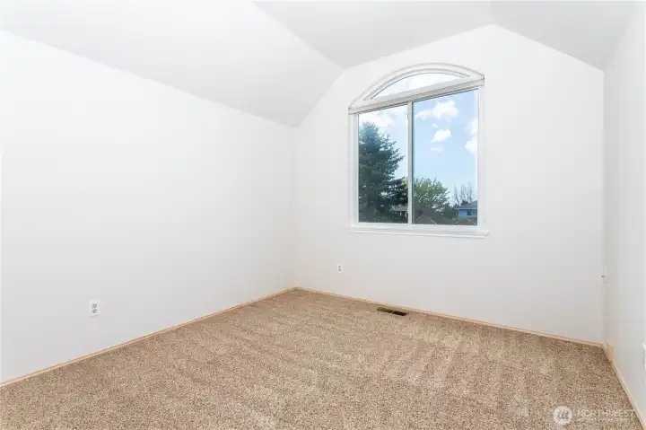 One of 3 additional bedrooms, facing west, vaulted ceiling